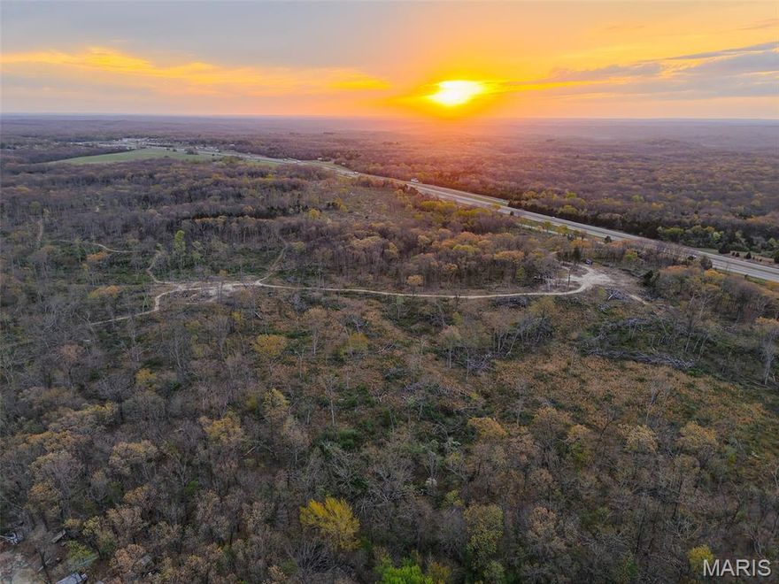This 188.7-acre property in Franklin County, Missouri presents a rare opportunity to acquire a highly visible and accessible tract positioned for both immediate recreational use and long-term development potential. Located between Stanton and Sullivan along the North Service Road, this property features approximately 0.8 miles of road frontage and outstanding visibility from both eastbound and westbound lanes of Interstate 44, making it a strategic location for commercial, residential, or mixed-use development.
The property’s gentle topography enhances its usability and development appeal. The terrain allows for straightforward planning, infrastructure layout, and site preparation, reducing potential costs associated with grading or access improvements. With active development already occurring in the surrounding area, this tract is well-positioned for investors and developers seeking to capitalize on growth along the I-44 corridor. Its proximity to a major metropolitan area, approximately one hour from St. Louis, further strengthens its appeal for both commercial ventures and residential expansion.
Recent logging activity has opened portions of the property, creating multiple potential build sites while still leaving a solid stand of remaining timber. These cleared areas provide flexibility for future development plans, food plot installations, or continued recreational use. The logging process has also established an extensive internal trail system, offering convenient access throughout the property for vehicles, equipment, or outdoor activities.
In addition to its development advantages, the property maintains strong recreational value. The land supports a healthy population of whitetail deer and wild turkey, making it suitable for hunting enthusiasts. The combination of timber, open areas, and natural travel corridors creates ideal habitat conditions. A small pond on the property provides a consistent water source for wildlife and adds to the overall usability of the land. The property also offers access to nearby streams in the area, expanding opportunities for fishing and outdoor recreation.
This tract delivers a balance of investment potential and outdoor lifestyle appeal. Whether the goal is to develop a commercial project, establish a residential community, create a mixed-use development, or hold as a long-term land investment, this property offers flexibility and value. Its location, visibility, and accessibility set it apart as a premier offering in a high-demand region of Franklin County.