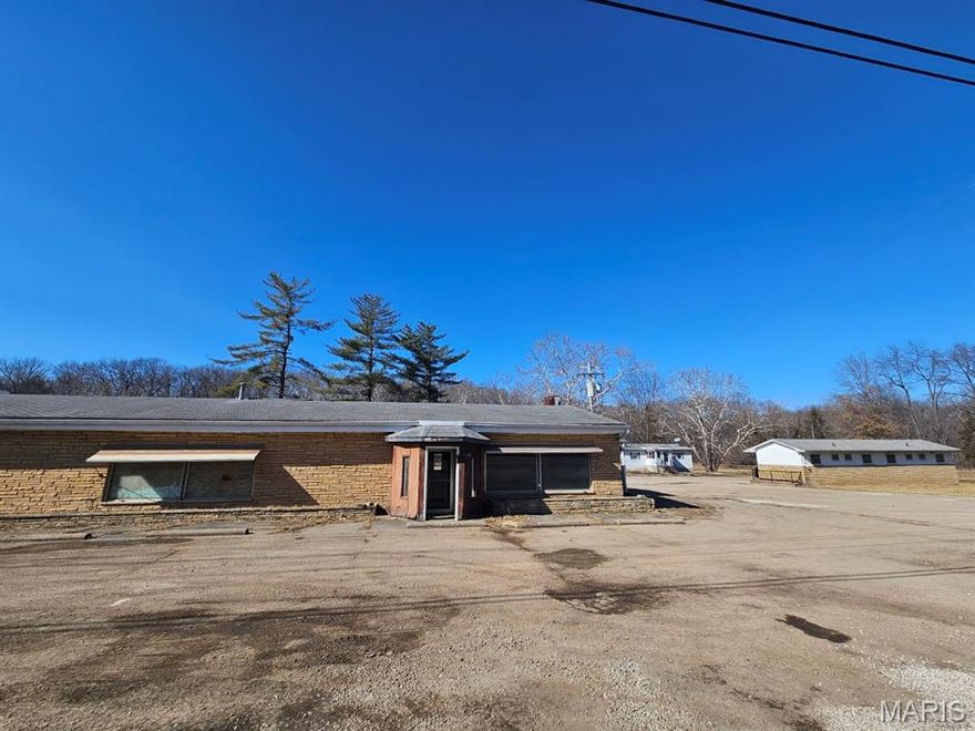 Exceptional commercial opportunity on 6 acres with prime highway frontage! This versatile property features four buildings and offers outstanding visibility and accessibility. Formerly operated as a restaurant with four hotel rooms, a three-bedroom residence, and a large outbuilding, the layout provides endless possibilities for redevelopment or continued hospitality use. Many upgrades were completed in 2018, and much of the existing equipment remains in good condition, offering added value for a new owner. The property is connected to public water and includes separate electric meters, providing flexibility for multiple tenants or business operations.