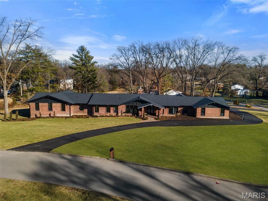 Priced to sell! Welcome to one of Frontenac’s most distinguished addresses. This sprawling mid century estate offers an architecturally stunning 6 bedrooms and 5.5 bathrooms —perfect for multi-generational living, seamless entertaining, and ultimate accessibility. This exceptional 6-bedroom, single-level ranch estate offers refined living on an expansive corner lot of over one acre. Designed with upscale finishes and a spacious, flowing layout, the home blends architectural elegance with modern functionality. Experience expansive Open-Concept Living: Soaring ceilings and vast Pella windows bathe the main living area in natural light, centered around a majestic brick fireplace. The Gourmet Chef's Kitchen is a culinary dream featuring professional-grade Sub Zero and Wolf stainless steel appliances, an oversized quartz-top center island, custom cabinetry. Situated next to the spectacular kitchen is a secondary pantry room featuring an additional food/party prep area, boasting a beverage center and full sized fridge, perfect for both intimate family meals and large catered events. The magnificent primary suite, located behind its own double door entry, provides a sophisticated retreat with a spa-inspired bath, heated floors, freestanding soaking tub, oversized shower, dual vanities, and a large his and her walk-in closets. The remaining three bedrooms on the main level are en suite and generously sized, ideal for family, guests. The main level also offers a secondary living room located in the bedroom area and a library with a second fireplace near the dining room. Step into a beautifully finished lower level designed for comfort, entertainment, and versatility. This expansive living space features two spacious bedrooms and two full bathrooms, offering the perfect setup for guests, extended family, or a private living area. An inviting bar and wine cellar area provides the ideal spot for hosting gatherings, while the dedicated movie theater room delivers a true cinematic experience right at home. Cozy up by the elegant fireplace, creating a warm and welcoming atmosphere year-round. Expansive windows and multiple glass doors create a seamless connection to the property’s outdoor living areas, offering covered spaces for dining and relaxation, as well as ample open grounds suitable for future enhancements such as a pool, sport court, or garden installations. The covered outdoor living room features a soaring stone wood burning fireplace perfect for relaxing with friends and family.
Additional Amenities: Custom-built ins and fine craftsmanship throughout, white oak hardwood floors in main level living areas, 4 car attached garage with abundant storage and wired for car charging. A statement of sophisticated, effortless living, this residence delivers an exceptional combination of scale, craftsmanship, and single-story luxury on a premier corner lot.  A prime, tranquil location with easy access to top schools, world renowned shopping and fine dining, offering a premiere luxurious lifestyle. This Frontenac masterpiece combines elegance, comfort, and convenience in one exceptional offering for your forever home.