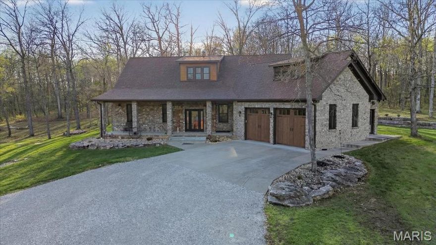 Get ready to experience one-of-a-kind living in this custom-built, full masonry home set on 23.4 unrestricted acres—a rare blend of craftsmanship, privacy, and functionality. Built to impress, the home features incredibly durable 17" thick walls, offering exceptional insulation and structural integrity. The owner (Adams Concrete & Masonry) is a masonry contractor and built it to last. No corners cut. 

A large covered front porch welcomes you into an open entryway and stunning great room with 20’ ceilings and a breathtaking floor-to-ceiling, see-through stone fireplace. The home showcases 6" baseboards throughout, stained concrete floors, and quality finishes at every turn.

The kitchen is designed for both everyday living and entertaining, complete with black stainless steel appliances, double oven with induction cooking, a large breakfast bar, Amish-made cabinetry with pull-out shelving, and a convenient walk-through pantry. The main floor laundry and separate mud room adds to the home’s thoughtful layout, while the dining room is elevated with elegant crown molding and a beautiful glass chandelier.

The main-level primary suite is a true retreat, featuring French doors leading to a spa-inspired bathroom with gorgeous epoxy floors, floor-to-ceiling tile, a curbless walk-in shower with dual shower heads, air-jetted tub, floating double vanity, and even a bidet. An additional bedroom on the main level provides flexibility for guests or family.

Upstairs, you’ll find a versatile space ideal for a home office or third bedroom, complete with a private bath and custom shower.

Step outside to enjoy a huge patio, custom stone retaining wall, beautifully landscaped beds, and even a creek running through the property—creating a peaceful, park-like setting. The automatic gated entrance ensures both privacy and security while the whole house propane generator offers peace of mind.

Car enthusiasts and hobbyists will appreciate the insulated, climate-controlled attached garage along with a 24x25 detached garage with concrete floor. 

This is truly a one-of-a-kind property—a rare opportunity to own a home where quality construction, thoughtful design, and natural beauty come together seamlessly.  I guarantee you won’t find another like it! 
Shown by appointment only - House can not be seen from the road! Showings start 4/9/26. Shown to pre-approved buyers only please!