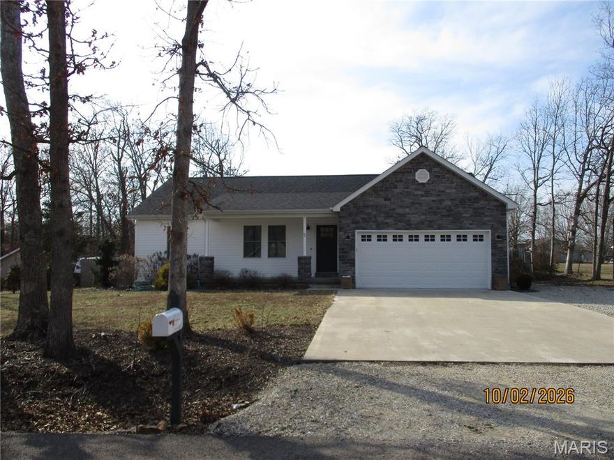 Virtually new home only 3.5 years old. home features 3 bedrooms, 2 bath located in the Oaks Subdivision. Custom built for the owners who did upgrades on the lightening and plumbing fixtures. Like new top of line appliances included. Beautiful lament flooring throughout. sitting on 1.5 lots with privacy fence in backyard. Exterior is white and gray with vinyl and rock. Professionally landscaped with water system in flower beds. covered front porch and patio in backyard. Subdivision has no thru streets for safety. owners relocating this is a rare find call today to preview this home.