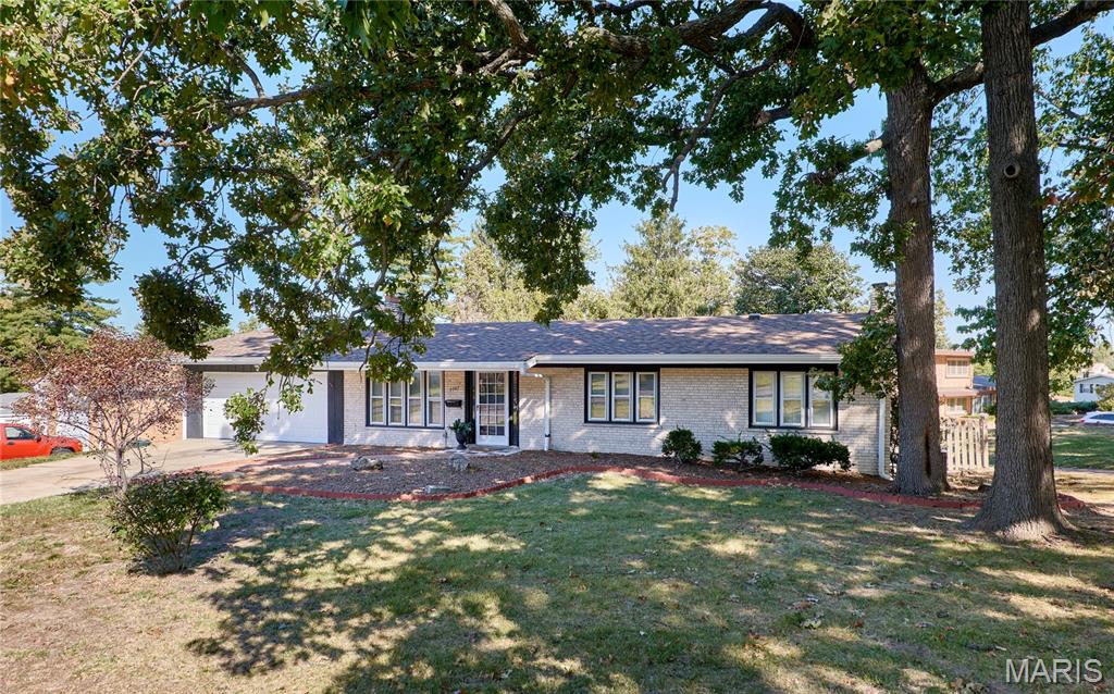 Photo of 7707 Springdale Drive, Normandy, MO 63121 (MLS # 26066446)