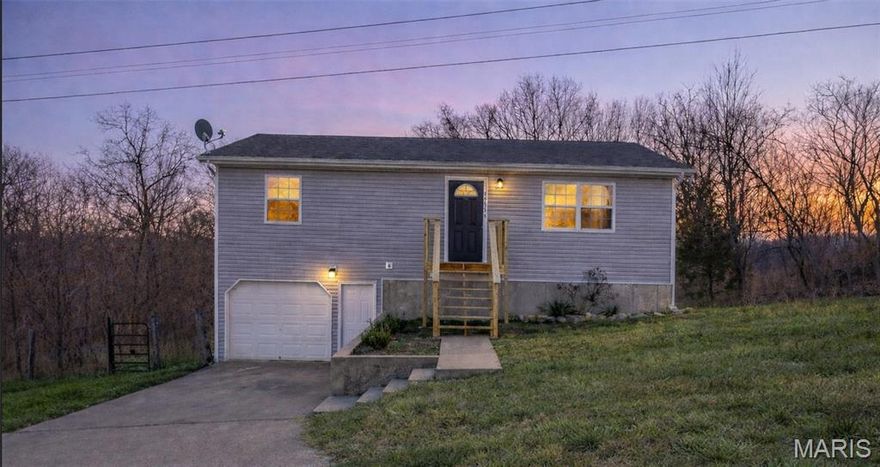 Move-in ready 3 bedroom, 2 bath ranch home conveniently located minutes from Fort Leonard Wood, shopping, and dining. This home offers approximately 1,400 sq ft of finished living space with a practical and comfortable layout. The main level features a bright living area open to the dining space, a functional galley-style kitchen, two bedrooms, and a full bath.

The lower level includes a private primary suite with a walk-in closet, full bath, and laundry area—ideal for added privacy or flexible living. The attached garage provides convenient parking and additional storage.

Recent updates include fresh interior paint, updated light fixtures throughout, and new front and back decks. The lot adjoins a wooded area, offering a quiet setting while remaining close to post and daily commuting routes. A great option for military buyers, first-time homeowners, or investors. Square footage and measurements are approximate.