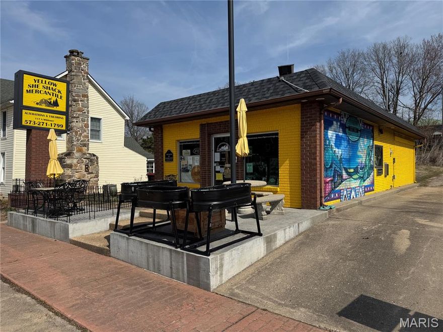 Are you looking for a "Turn-Key" business opportunity?  If so, the Yellow She-Shack Mercantile is a great opportunity for the right buyer!  Located in the quaint, historic city of Marquand, the Yellow She-Shack Mercantile was the vision of one woman who has poured her heart and soul into making the store what it is today.  "Everything from Fudge to Fabric," is the slogan you'll find on her marquis. Website, and Facebook Page, which pretty much sums it up!  Once inside, you'll find a wide range of herbal teas, remedies, and supplements, sitting alongside bolts of fabric, sewing notions, local honey, homemade fudge, fresh cuts of beef, glass-bottle soda, Native American handmade moccasins and beaded bags, straw hats, and so much more!  The new owner can pick right up with the current owner leaves off, with offering quilting fabric, sewing classes, alterations, seamstress work, herbal cures, unique gifts, craft supplies, all staged inside the former Bank of Marquand, a uniquely designed building that is inviting, fun, and serves the entire region.  On the exterior, you'll gaze in wonder at the beautiful Mural that was designed exclusively to depict the heritage of the Marquand community - it's Gorgeous!!!  

The business comes with the Fixtures and an Extensive Inventory (as it stands at the time of closing), plus a Brand New $15,000 Embroidery Machine so you can create customized embroidery for your customers, company and personal use!  As a start-up business, that's only existed for two years, the potential is only inhibited by your own imagination.  The lot offers the opportunity for expansion to the north, or in behind, or ever the possibility of adding an apartment by building an upstairs - get creative and make it your own!  You have 1,339 square feet of work and retail space to work with, which has proved to be ample for the current owner.  

The business has grown each year since opening in 2023, which indicates that the future has great potential.  With ample parking along Whitener Street, visitors can also stroll the beautiful Marquand Historical Park, enjoy the crystal-clear Castor River, and stop in at the other unique shops!