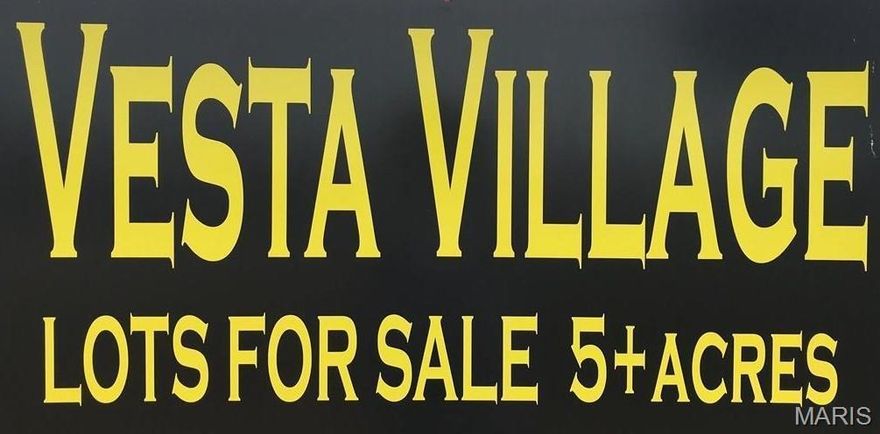 This is the subdivision to be in! VESTA VILLAGE. Just imagine, your dream home being built right there... in this beautiful subdivision, just minutes from town. 5+ acre corner lot with mature trees, on black top road. Utilities (water and electric) available. Road is maintained by the Special Road District. Restrictions are recorded to do apply.