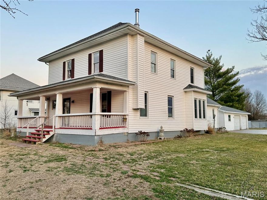 Charming 5-bedroom, 1-bath two-story farmhouse situated in town on just over half an acre!
The main level features one bedroom, convenient main-level laundry, and a full bath located just off the spacious kitchen. The kitchen offers abundant storage, including pull-out drawers and updated cabinetry. Upstairs, you’ll find four additional bedrooms.
This home is full of character with beautiful woodwork throughout, built-in cabinetry, stunning pocket doors, and a grand front foyer complete with built-in seating and an eye-catching banister leading to the second floor. A second staircase near the basement entrance adds extra convenience and charm.
Outside, enjoy a huge front porch perfect for relaxing, nice walkway between the 2-car detached garage and home.  A rare in-town property with space, charm, and timeless farmhouse appeal! Central air, forced gas heat. Partial basement.