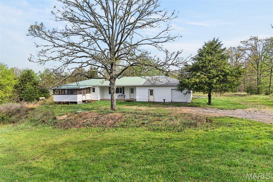 Located near Bennett Spring Park, this 2-bedroom home sits on 3 acres. The home is over 1600 sq ft, and it has an enclosed porch and a partially unfinished basement. Inside, you'll find an open-concept living area with a spacious kitchen and living room. The home needs work, but it presents an opportunity to turn it into a project for a second home. Only a few miles from the Bennett Spring Park. Whether you're looking for a weekend retreat or a place to call home, this property offers a great blend of charm, a country setting, and potential investment! Home needs TLC, selling "As Is.".