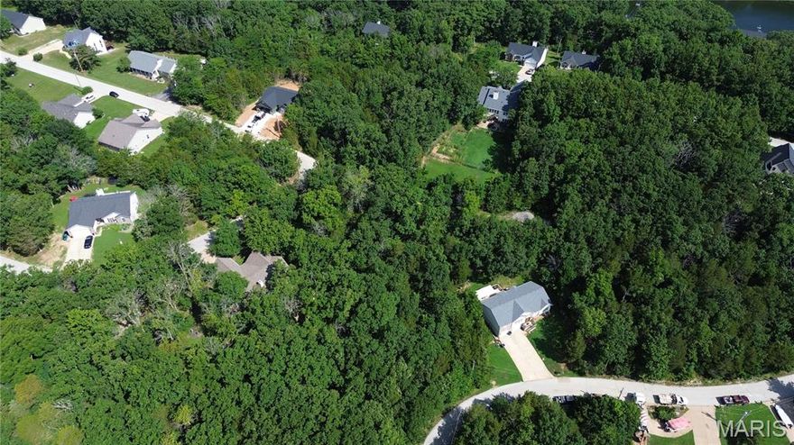 Right down from the BIG LAKE! Buy as an individual lot for lake access or check out the neighboring lots to purchase as a package and save, save, save! These ready-to-build home sites are located in this private, gated, resort-style community with 3 lakes, golf course, campgrounds and more. Perfect for builders to market to anyone seeking a peaceful, recreational lifestyle away from St. Louis, but still very close for easy family visits. Also perfect for "get-away" lake home. Enjoy the golf course, lake, boating, fishing, clubhouse, pool, etc. ! Just 20 minutes from South County!