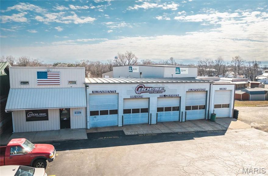 An exceptional opportunity to own a highly visible commercial property in the heart of Cuba. Long established as a successful automotive repair and service facility, this property is perfectly positioned for continued automotive use or a wide range of service-based businesses seeking strong exposure and accessibility.

The office area, constructed in 2013, offers a professional customer waiting area along with dedicated office space, creating a welcoming and functional business environment. Above the office, accessible through the shop, is valuable additional storage ideal for parts and equipment.

The spacious shop area measures approximately 29' x 65' and features five overhead doors--three with 12-foot clearance and two with 10-foot clearance--allowing efficient workflow and accommodation for multiple vehicles or large equipment. Situated on approximately 0.5 acres, the property provides abundant parking with room for future expansion.

With nearly 200 feet of road frontage and location near one of the highest traffic counts in town, this property delivers outstanding visibility and daily exposure for your business. Whether expanding an existing operation or launching a new venture, this turnkey commercial location offers the space, access, and presence needed for success. Opportunities with this level of visibility and functionality are rare, act quickly.