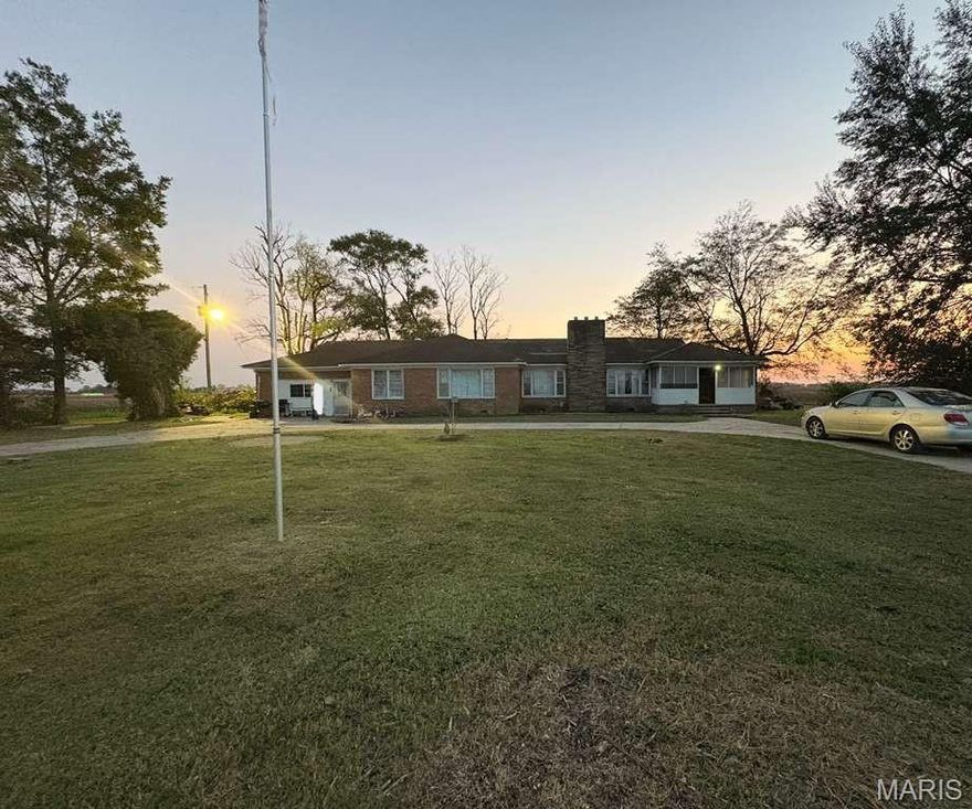 Secluded rural home on a wooded lot with a welcoming circle drive. The 3,026 sq ft interior shines with recent DIY updates!
You'll find new flooring throughout, fresh paint, modern fixtures, and a completely remodeled full bath. The spacious two-car enclosed garage is pre-set for a wood stove installation. This residence, with its vintage character, utilizes efficient propane wall heaters and window A/C units for flexible climate control.