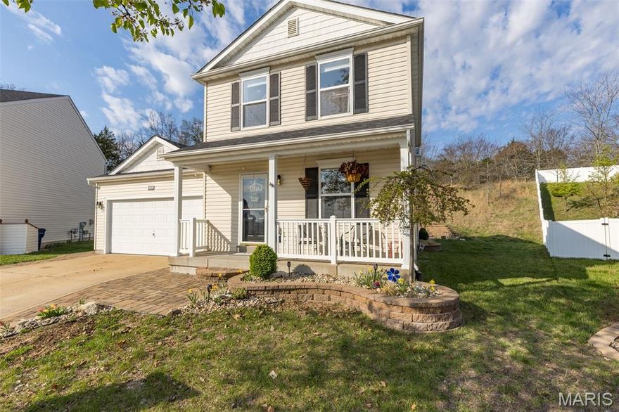 Welcome home to this beautiful 2-story residence tucked at the end of a quiet cul-de-sac. From the moment you pull into the hardscape-lined driveway and follow the custom walkway, the quality and care put into this home are unmistakable. Inside, porcelain tile flooring flows throughout the main level, complemented by detailed trim work and wainscoting. The updated kitchen features tall custom cabinetry and exceptional storage, creating a stylish and functional centerpiece for daily living. Just down the hall, you’ll find the main-floor laundry, a spacious primary suite with a generous walk-in closet, and a full bath. Upstairs opens to a large loft—perfect for a second living area—along with two additional bedrooms and a full bath. Carpeting and professional closet systems elevate the entire upper level.  Step outside to your private half-acre retreat backing to woods. The custom-finished patio includes built-in bench seating and a firepit, ideal for gatherings. A second patio offers even more fun with a basketball hoop. Surrounded by a custom retaining wall, this outdoor oasis is destined to become your favorite place to unwind and entertain.