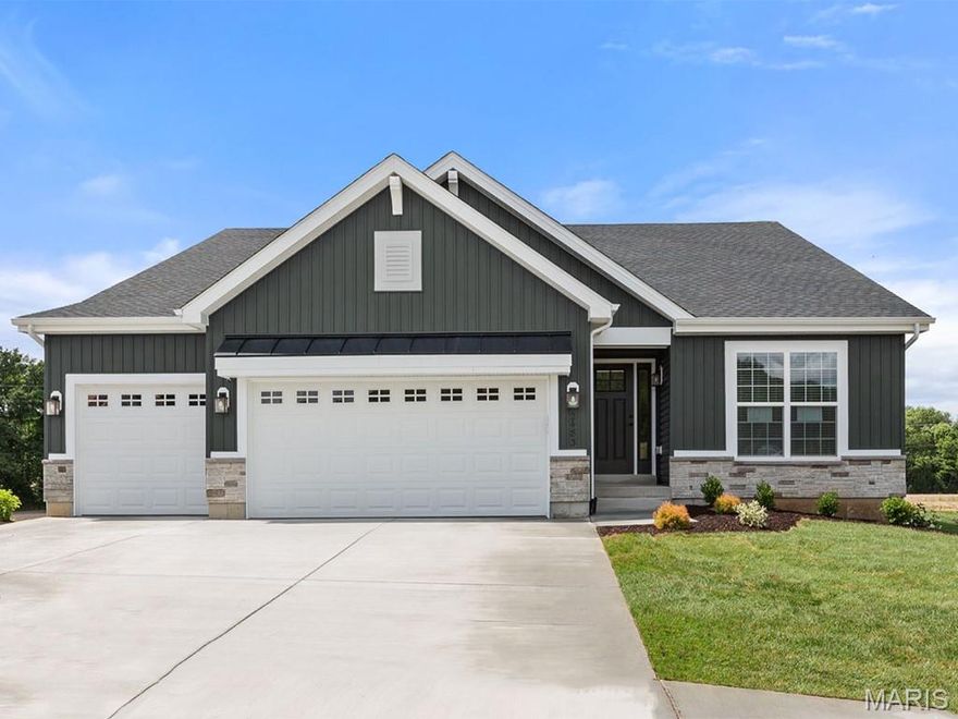 New McBride Homes Maple Expanded ranch 3BR, 2BA, ready this summer! Rustic Farmhouse exterior! This home has a 3-CAR GARAGE, open floor plan w/vaulted ceilings, living rm w/ceiling fan, 6’ windows, & wood laminate flooring in the main living area. The kitchen has Landen Burlap 42” cabinets, lg center sq. island w/breakfast bar, quartz countertops, & stainless GE appliances. The master suite has a ceiling fan, walk in closet, & private bathroom w/a corner tub w/window, shower w/seat, dual vanities, & private toilet rm. 2 more BRs w/ceiling fan prewires, 2nd full bath, & main floor laundry add convenience. Upgrades include 2 panel interior doors, garage coachlights, LL ¾ bath rough-in & more. Langeneckert Farm offers beautiful new homes in Mehlville with convenient access to shopping, dining, parks, and major highways for easy commuting throughout St. Louis County. Enjoy peace of mind with McBride Homes’ 10 year builders warranty & incredible customer service! Similar photos shown.