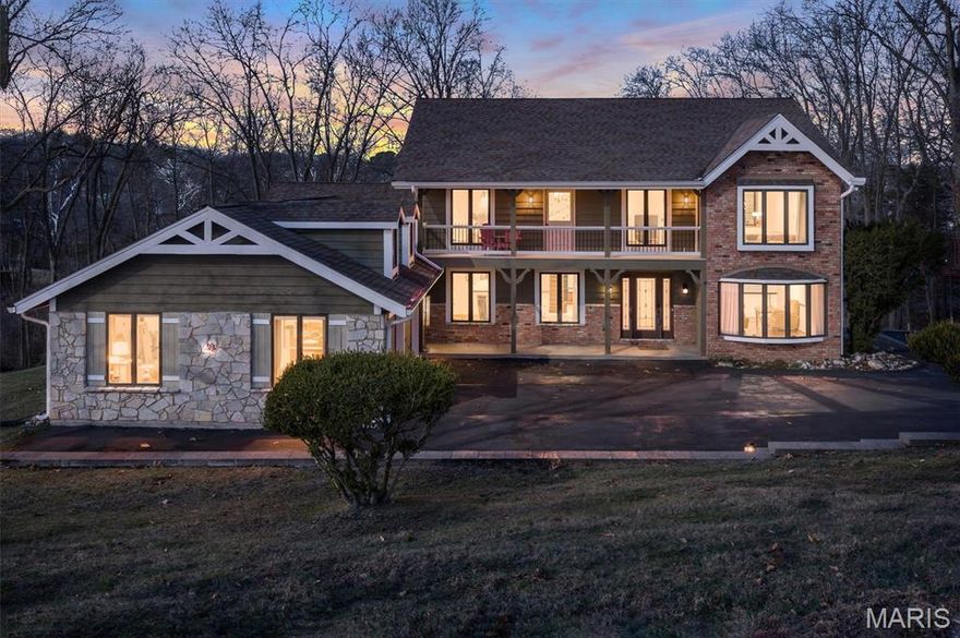 Welcome to 2015 Wakefield Farm Road, a stunning lake front private sanctuary situated on 3.78 acres in Wildwood. This impressive residence offers 5 bedrooms and 4.5 bathrooms with rare frontage on a serene community lake. Quality wood details are found throughout the home, adding a touch of timeless craftsmanship to every room.

The main level welcomes you with beautiful white oak wood floors and a versatile floor plan. For traditional hosting, the home includes both a formal living room and a formal dining room. The family room serves as a comfortable retreat featuring natural wood beams on the ceiling and a cozy fireplace. A spacious eat in kitchen flows into your family room which leads you out to a screened in porch that is perfect for enjoying the outdoors in comfort. This level also offers a main floor bedroom or office, 1.5 bathrooms, and a convenient main floor laundry room.

Upstairs you will find brand new carpeting throughout the bedroom level. The primary suite is a private haven with a beautifully updated primary bathroom and its own second story deck looking out over the front of the property.

The lower level is designed perfectly for entertaining on a large scale. This massive open finished basement provides endless possibilities for a game room, media center, or social hub. It features a second fireplace for a warm and inviting atmosphere and includes an additional full bathroom for guests. The space walks out directly to a scenic backyard and a custom patio featuring a built in fire pit and an additional porch area.

Significant mechanical updates provide peace of mind, including 2 HVAC units that are only 2 and 3 years old. This property offers the perfect balance of a secluded lakeside retreat and functional modern living. Schedule your private showing to experience this unique Wildwood estate.