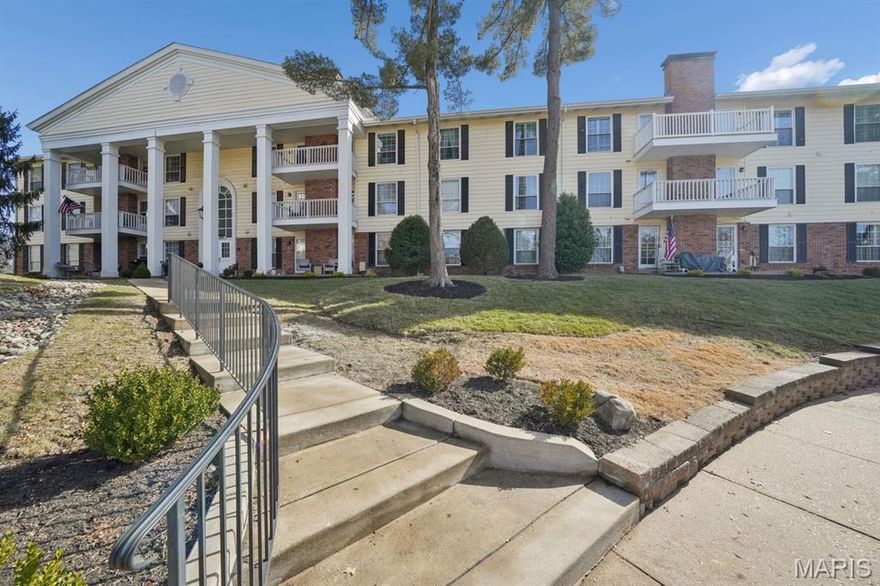 This beautifully updated home is ready for you to move in and enjoy condo life. The main-level unit is tucked away in the corner of the building, offering a sense of privacy. The living room is the perfect place to relax and has a cozy gas fireplace, flanked by doors out to the covered patio where you can enjoy lovely views of the lawn. The updated kitchen offers sleek stainless appliances, a center island, soft-close drawers and cabinets, a pantry, and a breakfast room for casual dining. A separate dining room gives you space to host more formal meals. The primary bedroom suite has a walk-in closet with organizers and a full bath with shower. The second bedroom is served by the hall full bath. Laundry is conveniently in-unit and extra storage space is downstairs in the basement. Coming home is easy, just drive in the garage and take the elevator up to the unit! The community also features beautiful grounds, a club house, and a swimming pool.