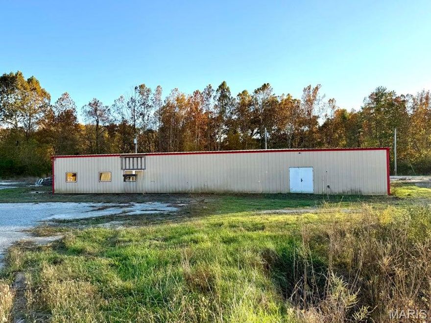 2.7 acre Commercial Property located at the intersection of Hwy 63 and Hwy B in Houston, Missouri. High visibility location with easy access. 10,000 sq ft metal building with spray foam insulation, concrete floor, city utilities, open ware house space, wood paneled offices and restrooms. Some TLC needed to exterior. 45 minutes to Rolla, 90 minutes to Springfield and 2 1/2 hour to St. Louis.