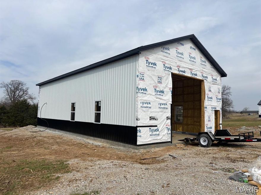 Brand NEW Barndominium @MarkTwainLake...RIGHT NEXT DOOR TO ANOTHER ONE!  Completion date April 2026!
No HOA fees, just country living/vacation getaway/your own slice of heaven on 3 to be surveyed acres.  Location! Location! Location! 
Situated between Clarence Cannon Dam and Jellystone, with limited gravel!  Some mature trees, rural water, fiber, rural electric and your private sewer are all part of the package.
This 30 x 60 structure is fully of all your dreams! The interior of this barndominium packs a punch with the garage area being totally finished, metal insulated wallls and ceilings for luxury storage or dreams of more defined living space. The Living Quarters - a statement of contemporary, relaxed living - Open span living, dining, kitchen area with the laundry and bath conspicuously tucked under the stairway to the loft.  The loft offers sleeping area for a single bedroom or a bunkhouse gang!  
You're at the lake, so there has to be outdoor living!  How about a covered patio to grill, gab and gather! 
Appliance package, (with washer/dryer), great lighting package, EXTRA - outside RV hookup, Overhead door, walk-in door...it will just be a finished package - bring your clothes and come on!  
Near Spalding Recreation Area, Warren G. See Spillway, Ray Behrens Rec Area/Campground, Blackjack Marina and many other attractions.
Get started on Summer 2026 now...See it! Love it! Own it!  TODAY