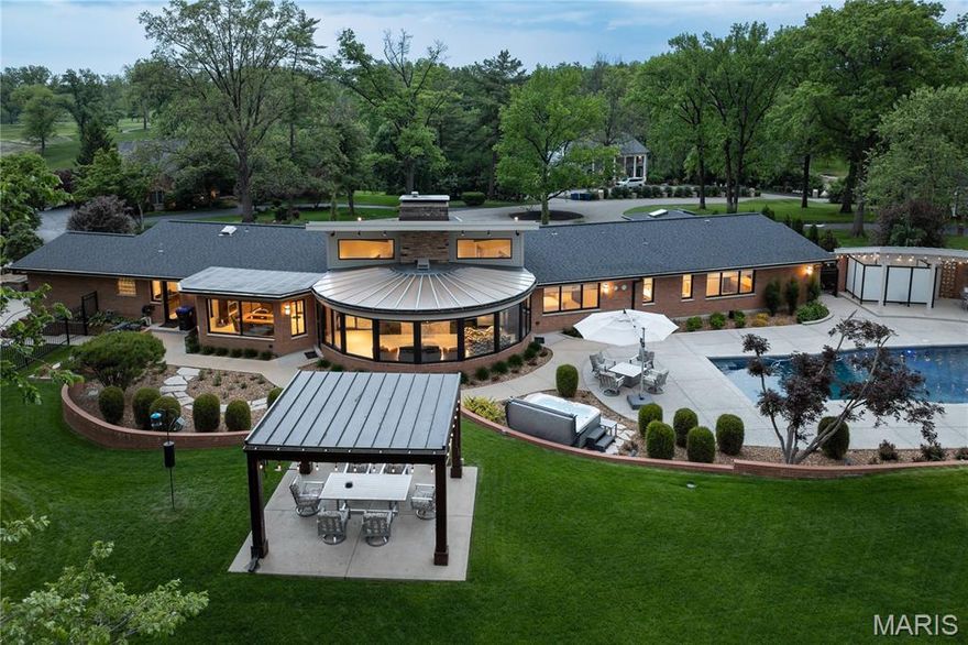 Don't miss out! Sharp price adjustment makes this stellar property an extraordinary cost value proposition for location, setting, size and condition. A must-buy Mid-Century Modern completely reimagined and rehabbed, inside and out effectively creating a 5 year old home, pool, and landscape. On the grounds of prestigious Westwood Country Club. 5BRs, 6BAs, and nearly 7,300SF of finished living area. The home pays homage to original architect Ralph Hohlt, while presenting a thoroughly modern masterpiece, with highest levels of finish and technology and a completely turn-key experience. No amenity is left undone. Hallmarks include vault ceilings, marble and stone flooring, solid mahogany doors, low voltage Smart House features including audio, video, lighting, heating, cooling, and security all controlled by touch screen or SmartPhone. Chefs kitchen showcases Zanzibar ebony and acrylic white high gloss cabinetry, SubZero, Wolf, Thermador, Bosch, and Fisher & Paykel appliances. Primary suite expansion created a luxe bath with room-size organized closet. A 2nd Primary Suite on Main Level is at the far end of Main Level, creating ultimate privacy and  separate quarters. A 5th suite on Main Level is ideal for in-laws/au-pair, with a private exterior entrance. Lower level includes media, recreation, exercise, and game rooms, full kitchen and bath, amd abundant storage. The pool is refinished; all systems rebuilt. Pool house with full bath and shower offer additional storage. Entirety of grounds, landscaping, retaining walls, patios and circle drive have been replaced. A pergola completes the property.