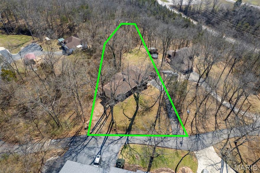 Welcome to this inviting 3-bedroom, 4-bath home located in the desirable Seclusion Woods subdivision. This unique home offers a sunken living room and a bedroom area that you access by 3 steps.  Perfectly situated with easy highway access, this property offers a convenient commute while still providing a peaceful neighborhood setting. Step inside to find beautiful hardwood flooring and an updated kitchen featuring stainless steel appliances, making it a great space for cooking and entertaining. The home also offers the convenience of main floor laundry and comfortable living spaces throughout. The partially finished basement provides extra room for a recreation area, home office, or workout space, along with additional storage. A tuck-under garage adds convenience and protection from the elements. Outside, enjoy maintenance-free siding for easy upkeep and more time to relax. Located in the top-rated Jefferson R-7 School District and just minutes from Festus, you’ll have quick access to shopping, dining, and everyday amenities. This home combines comfort, convenience, and a fantastic location—schedule your showing today!