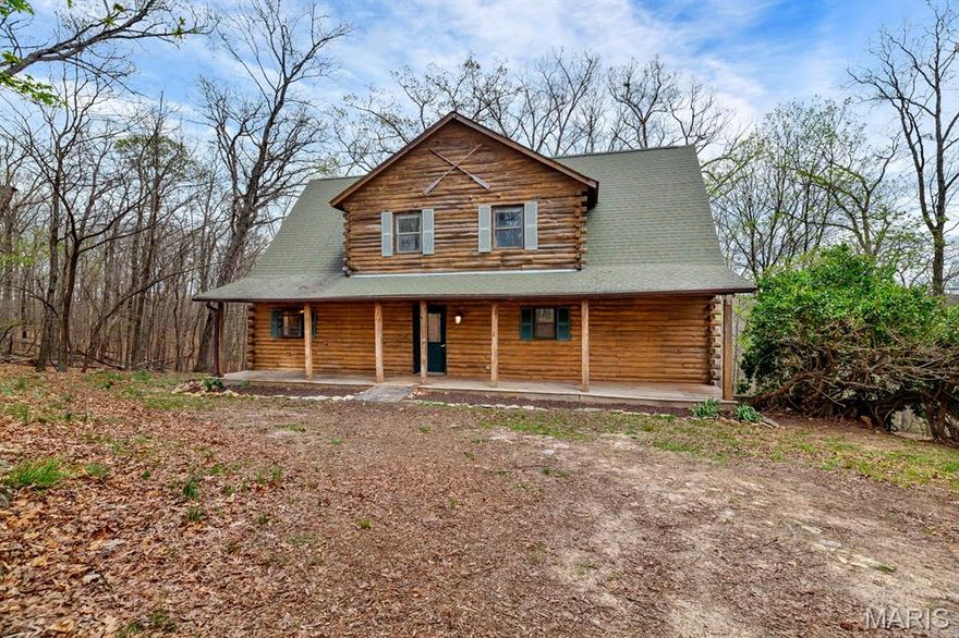 Fixer upper special! This charming log cabin at 1192 Quiver Court in the Lake Sherwood community offers a rare opportunity to own your ideal retreat. Tucked away on a quiet cul-de-sac and surrounded by mature trees, the home features rustic character with exposed wood, vaulted ceilings, and a cozy stone fireplace. The spacious layout includes an open living area filled with natural light, along with a functional kitchen and comfortable bedrooms ready for your vision. Main floor primary bedroom suite and main floor laundry add convenience, while doors from the bedroom, living room, and kitchen lead to an expansive deck—perfect for enjoying the peaceful setting. In the winter, take in views of the ridge line, and in the summer, enjoy complete privacy nestled in the trees. House needs some attention and is perfect for the person who wants to put their own touches on it. With solid bones, great outdoor space, and access to private lake amenities, this property is full of potential for the right buyer. Seller is selling as-is and does not intend to make any updates or repairs; price reflects condition.