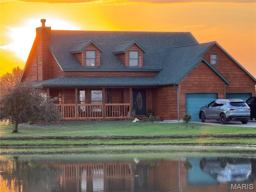 Custom-built in 2003, this stunning cedar-sided country home sits on 11.95 peaceful acres. With 3,886 sq ft of living space, it offers 4 bedrooms and 3.5 bathrooms, blending comfort and functionality. Relax on the covered front porch with views of a scenic stocked pond, or entertain on the back deck overlooking open fields where wildlife often roam.  Enjoy cozy evenings in the open living room next to the beautiful wood-burning fireplace. This home is thoughtfully designed with intricate details and ample storage.  A spacious 2-car garage with additional attic storage access. If you're seeking rural charm in a prime location between Palmyra and Monroe City, look no further—this is the one.