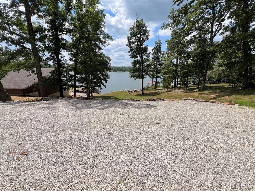 Sunshine and Lake breezes come with this sparkling lakefront lot with concrete sea wall and 2 boat slips,
including one with a new boat lift in 2024 for your convenience the perfect weekend retreat for your
busy life style. Enjoy the beautiful large rock landscaping to enhance the perfect spot to build your
dream getaway or camp for a weekend. You can sit at your dock and enjoy beautiful sunsets; what a
perfect way to end your day and enjoy lake breeze with a cool drink, watching the sun sink. Well
maintained lake front lot. A real treat at this price---there’s not many lake front lots left. Electric and
water is located on this property. Don’t forget all the amenities Lake Perry has to offer:  pool, bathrooms,
shower houses, laundry area, sandy beaches, playgrounds, fishing, swimming, boating, skiing, marina
area, on site food truck during the summer season and so much more at Lake Perry. This is a rare
opportunity that you won't want to miss.