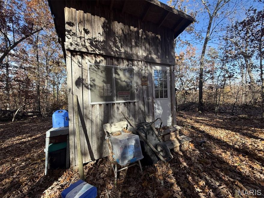 Tucked away on 5.9+/- beautifully wooded acres, this off-grid cabin offers the privacy you have been looking for! Sitting on top of the hill you will fall in love with the cutest cabin surrounded by mature trees. There is a wood burning stove in the cabin ready for you to install. Property also has a compost outhouse and a tool shed and a fire pit to gather around. Easy access from Highway 67 makes it convenient if you have a camper If you are looking for that secluded retreat or a great place to build, with no restrictions you have the freedom to make your dreams come true!