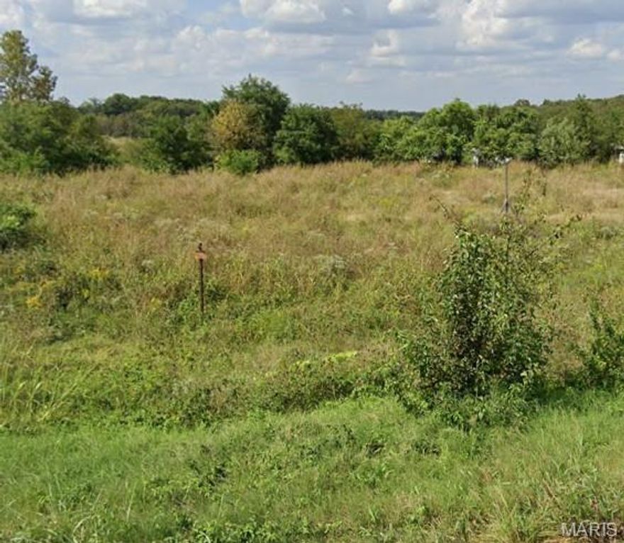 Large corner lot, approx. .98 acres, located on busy intersection.  Great visibility for your business plus close to highways.