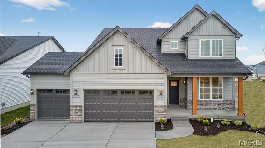 MOVE-IN READY ON HOMESITE 102! Welcome to 2009 Bruce Trail Court in the highly sought-after Cottleville Trails community. This beautiful 2-story Adams floorplan offers 4 bedrooms, 2.5 bathrooms, and an open layout designed for modern living. The first floor features 9-foot ceilings and an inviting great room anchored by a 55-inch electric fireplace. An open staircase with wrought iron spindles adds a touch of elegance, while the covered back porch creates a perfect outdoor retreat. The gourmet kitchen is a true centerpiece, showcasing quartz countertops, a custom island with added cabinetry, GE built-in ovens, gas cooktop, built-in microwave, and a stylish chimney hood. A butler’s pantry enhances both function and flow, making this home perfect for entertaining. The owner’s suite is a private retreat with a luxury bath that includes a spacious walk-in shower with a bench seat. Upstairs, three additional bedrooms provide comfort and space for family and guests. Additional highlights include a 9-foot in-grade foundation offering flexibility for the lower level and a 3-car garage for extra storage and convenience. Designed with today’s families in mind, Lot 102 at Cottleville Trails combines thoughtful details, stylish finishes, and McKelvey Homes’ renowned craftsmanship in one of the most desirable communities in the region. Schedule your tour today and discover the perfect balance of comfort, style, and function in this Adams at Cottleville Trails.