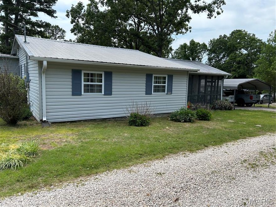 Welcome home to this inviting 2-bedroom, 2-bath home nestled on two lots totaling approximately .48 acres in the Ellington area, just 1.5 miles from Clearwater Lake. Offering a wonderful blend of space, functionality, and outdoor enjoyment, this property features multiple detached carports including covered parking for vehicles plus an additional boat carport. Inside, the kitchen serves as the heart of the home with a pantry, gas stove, and ample space for gathering. The spacious primary suite offers a private full bath, an oversized walk-in closet, and beautiful wood flooring. A sunroom adds extra living space, while the office/den provides flexibility for working from home or hobbies. Main floor laundry adds everyday convenience. The unfinished walkout basement includes generous storage and workshop areas with plenty of potential. Step outside to enjoy the recently painted deck, ideal for relaxing or entertaining, along with a storage shed for added convenience. A fantastic opportunity near the lake with room to spread out and enjoy!