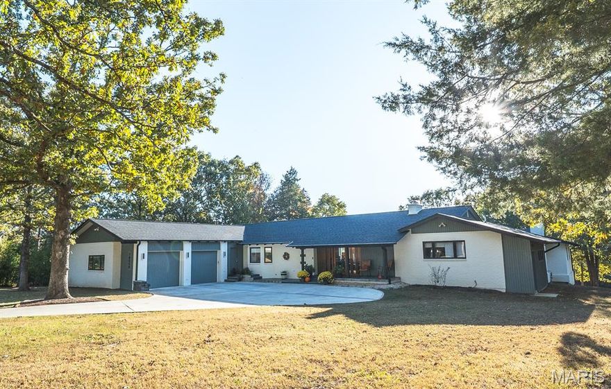 Originally built in 1998, this 5 bedroom, 5 full-bath, 2 half-bath home has undergone a sophisticated renovation that has transformed it into a sanctuary. The home sits on a private 0.86A lot backing up to a lake in The Pines subdivision. Initially built with an indoor inground pool, the extensive renovation addressed installing a floor over the existing pool area to allow for a new primary suite and an additional bedroom. A few interior walls were moved during this renovation to accommodate the relocation of the front entrance and the interior stairs, installing a lift (elevator), new utility room, walk-in pantry, inclusion of a new full bath, expansion of the conditioned garage space (975 SF), and entrance ramp from the garage. The new 42-inch front door with sidelights adds curb appeal to this extraordinary home. Warm white oak flooring, doors and trim blend effortlessly with any decor'. The kitchen is a chef's dream with walk around central island, natural Quartzite stone countertops, custom lighting, separate freezer/refrigerator, upgraded appliance, walk in pantry, baking center and much more. The main floor primary suite is large and divided into lounging and sleeping areas. The new primary bathroom is fully equipped with stand-alone shower and walk-in tub, large closet and two vanity areas. There are two other ensuite main level bedrooms and a 4th bedroom with a hall access bathroom. The main level also includes an office with an adjoining craft room. A screened in porch is accessible from the living room and provides 3 seasons of enjoyment. A second full kitchen is in the lower level along with a 5th ensuite bedroom, half bath, family room, utility room, and storage area. The lower-level family room daylights across the back of the house. There are three natural gas supplied fireplaces and a hook up for an outside grill. This home has so many amenities, a comprehensive list is attached of all the home improvements including associated costs. This is a MUST-SEE property if you're in the market for an exceptional quality residence. Call for more details.
A new roof was installed in 2023, and there are (3) zoned Water Furnace Geothermal systems. Also included are two motorized chandelier lifts to drop hard to reach large decorative ceiling lights for easy cleaning and maintenance. Home is wired for a sprinkler system and a generator and has a home alarm.