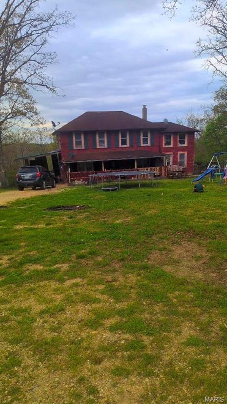 Large 2-story home on 3+/- acres offering privacy while remaining conveniently close to town. Features an oversized deck with views of the backyard, ideal for outdoor enjoyment. Home offers substantial square footage with endless potential to customize. Bring your vision!!  Great opportunity for buyers seeking space, privacy, and value, and to make it their own.  Put that sweat equity to work!