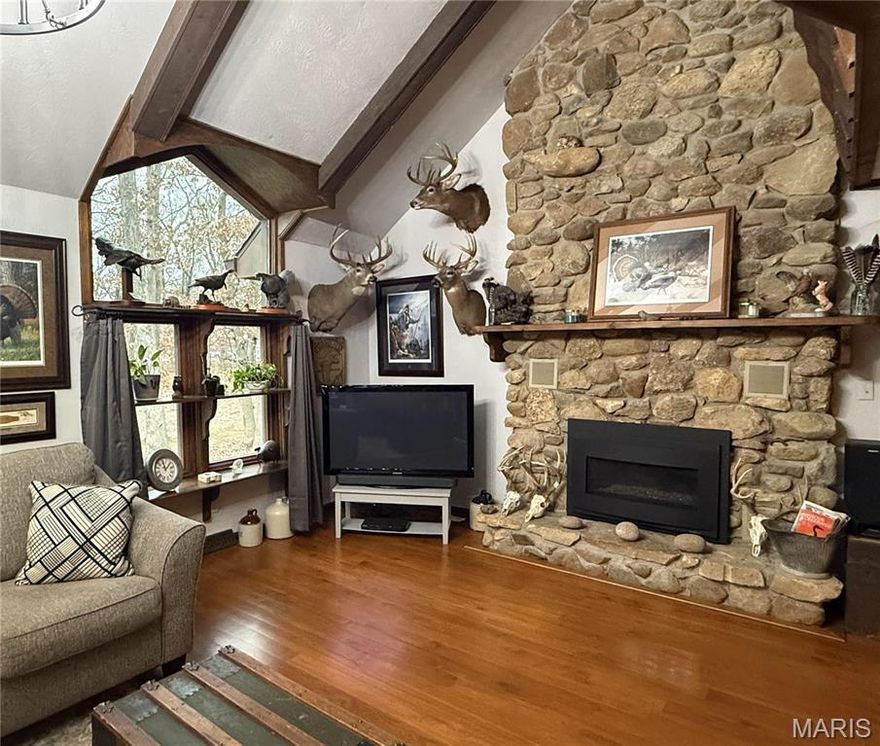 Welcome to your dream retreat in Kirksville, Missouri! This beautifully renovated rustic A-frame home sits on 4 serene wooded acres, just minutes from town. Featuring newer windows, a modern roof, and efficient electric heat & air, this home combines comfort with
charm. Enjoy the fresh ambiance with new sidewalks, an inviting upper deck, and stylish paint throughout. The spacious interior boasts a spacious living room with a grand stone fireplace, perfect for gatherings, while the exterior showcases updated garage doors and picturesque surroundings. Don’t miss the chance to own this stunning sanctuary that blends nature with modern living! Book a showing TODAY!