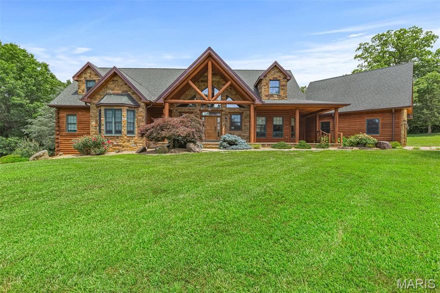 Beautiful 4 bedroom home on over 9 acres with inground pool! Home is super spacious yet cozy enough that it makes the perfect home. Super private yet not too far away from everything. The stone work and wood work are simply amazing! Master bedroom suite with a custom stone fireplace and it's own covered balcony. Master bath with separate jetted tub and tile shower. Living room also has a custom stone fireplace. Kitchen complete with granite countertops, tile backsplash, breakfast bar. The vaulted ceilings and open staircase are absolutely stunning. Property is waterfront. Wildlife and recreation galore. This home is like living at your very own resort!