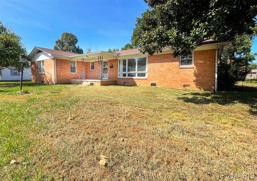 Welcome to your new home! This spacious 3-bedroom, 2-bathroom residence offers over 1700 sq. ft. of living space, and there's a detached garage/workshop... It's located close to the schools and just minutes from shopping!
Extra's include: Front covered porch 15x8 / Nice size living room offers a large picture window / Hardwood flooring throughout most of the home / Ceramic tile flooring in the kitchen / Utility rm has built in cabinetry / Hall storage closet / Pull down attic steps / Over-sized owners bedroom  / Full bath has a tub shower with glass doors, & there's a second bathroom with a shower / Ceiling fans / Brick exterior / Guttering / Shingle roof new within last few years / Central heat & air / Concrete  patio.
Detached garage is 14x24, it opens to a 14x32 workshop with alley access down the East side.
Owner was in process of doing some upgrades, the piece of granite counter & Kohler bathroom sink will stay with the home for new owners to install. 

More pics coming soon!