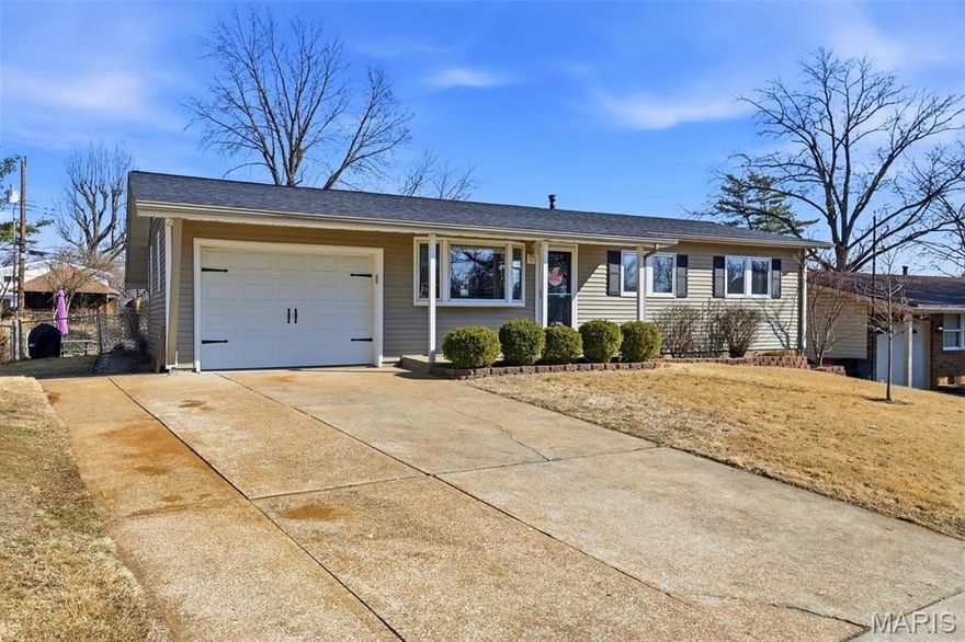 This thoughtfully updated and lovingly maintained home is the one you’ve been waiting for! Impressive curb appeal with double driveway, oversized one-car garage, new roof (2025), covered front porch and welcoming landscaping. Step inside and feel right at home when you see what the main level has to offer: gorgeous hardwood floors in the family room and three main level bedrooms, brand new professionally installed LVP in the full main-level bath and kitchen, and tons of natural light from the bay windows with custom blinds. The large eat-in kitchen is the heart of this home with white cabinetry, modern hardware, and plenty of space for both an island and a dining table. The finished lower level impresses: a huge flexible rec area/family room, newer 30-year performance carpet (2020) throughout, fresh paint throughout, second full bath, storage room, and bonus sleeping area! Check off the rest of your boxes when you step outside to the huge covered patio with ceiling fans-- an oasis for sipping coffee, grilling, and watching the family enjoy the large, level fenced backyard. Raised garden beds, perennial butterfly garden, and convenient storage shed will help you create the backyard of your dreams! Newer systems (HVAC/water heater/whole-house humidifier) and a brand new roof make this a truly move-in ready gem. Highly rated Lindbergh schools, walkable to parks, stores, and restaurants.