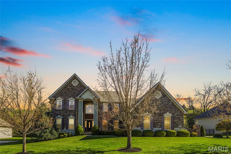 Welcome to 9810 Grandview Lake Court. This stunning 1.5 story home offers 4 bedrooms, 3.5 baths, and over 4,700 square feet of beautifully designed living space on a private cul-de-sac lot.

The impressive brick exterior and manicured landscaping create exceptional curb appeal. Inside, soaring ceilings and walls of arched windows fill the home with natural light. The two-story great room features expansive windows overlooking the backyard and flows seamlessly into the spacious kitchen with granite countertops, center island, custom cabinetry, stainless appliances, and walk-in pantry.

The main floor primary suite offers a peaceful retreat with large windows, spa-like bath with soaking tub, separate shower, dual vanities, fireplace, and an oversized walk-in closet with center island. A formal dining room and refined living room with custom built-ins provide ideal spaces for entertaining.

Upstairs you will find generously sized secondary bedrooms and additional living space. The finished lower level expands your options for recreation, media, fitness, or guest accommodations.

Enjoy outdoor living with a private backyard setting, large windows throughout, and abundant natural light in every room. With nearly 4,708 square feet, a functional 1.5 story layout, and timeless finishes, this home offers the perfect blend of elegance and everyday comfort in a highly desirable location.