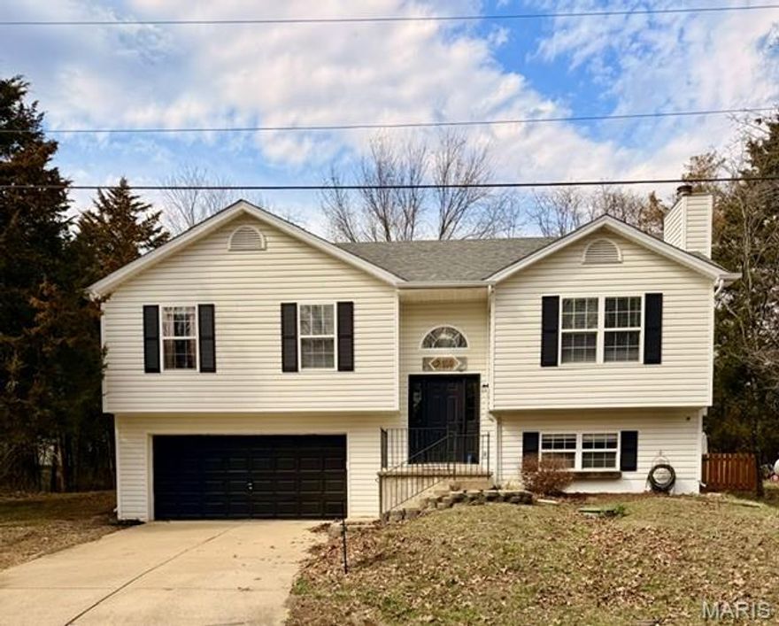 Spacious split-level home in the sought-after Lake Sherwood community offering 4 bedrooms, 3 full baths, and an oversized 2-car attached garage. Tucked away on a flat, level lot at the back of the subdivision, this property is ideal for those seeking privacy and seclusion, while still being conveniently located near the campground area.

Inside, you’ll find beautiful updates throughout, including modern fixtures, an open floor plan, luxury vinyl plank flooring, and vaulted ceilings. The living room features a cozy wood-burning fireplace, creating the perfect gathering space. The primary suite offers a stunning bay window, vaulted ceilings, a walk-in closet, and a spa-like bath complete with a separate soaking tub, separate shower, double vanity, and a picture window overlooking the park-like backyard. 

The finished lower level includes a fourth bedroom, spacious recreation room, and a third full bath—ideal for guests or additional living space. The oversized 2-car garage offers ample storage and room for a workshop area.