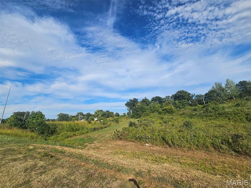 Exceptional opportunity to acquire a strategically located 5-acre parcel. Zoned for commercial use and ideal for a wide range of retail developments. This site has a completed, signalized intersection and sits along a busy access road, ensuring maximum exposure. Convenient access to major highways and nearby fuel stations enhances both consumer and logistics appeal. Highlights: corner location, high traffic for optimal visibility, fully signalized intersection for easy access. Ideal for retail, service, or mixed-use development. Don't miss this chance to secure a standout location in a thriving community.