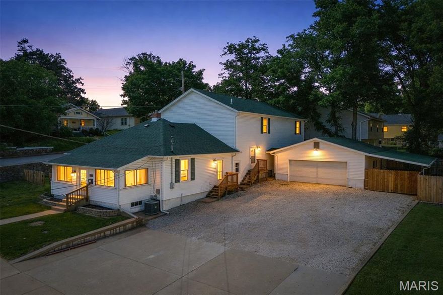 Welcome to this beautifully updated 1.5-story home offering 3 bedrooms, 2.5 baths, and situated on two spacious lots in the highly desirable Festus R-VI School District!

This inviting property offers the perfect blend of charm, space, and functionality with numerous recent updates throughout, including fresh interior paint, a brand-new roof, newly replaced porch steps, and new fencing along the back of the property for added privacy and peace of mind.

The expansive main-floor primary suite is a standout feature, complete with French doors that open to a large covered porch on the Ridge Avenue side, creating the perfect private retreat for morning coffee or relaxing evenings. The ensuite bath offers exceptional storage with two walk-in closets.

Upstairs, you’ll find two generously sized bedrooms, each featuring large walk-in closets and connected by a convenient Jack-and-Jill bathroom, along with a spacious upper-level family room that offers endless possibilities as a second living area, game room, or media space.

The main level also features a flexible bonus room just off the kitchen, ideal for a formal dining room, home office, playroom, or additional sitting area. The adjoining main-floor laundry and mudroom area, complete with a utility sink and convenient 1/2 bath adds everyday ease and functionality.

Step outside and enjoy multiple outdoor living spaces, including a fenced concrete patio area beside the garage featuring a lean-to, fire pit, and storage shed—perfect for entertaining, relaxing, or enjoying evenings outdoors. The fenced side yards provide even more usable outdoor space for pets, play, or gardening.

The detached 2-car garage with its own half bath is an incredible bonus, offering added convenience for guests, hobbies, or workshop use.

Additional bonus: the newly installed stop sign at Central and Ridge has greatly slowed traffic, enhancing the appeal of this corner location.

With space, updates, flexible living areas, and fantastic outdoor features, this home is a must-see and offers exceptional value in a sought-after location!
