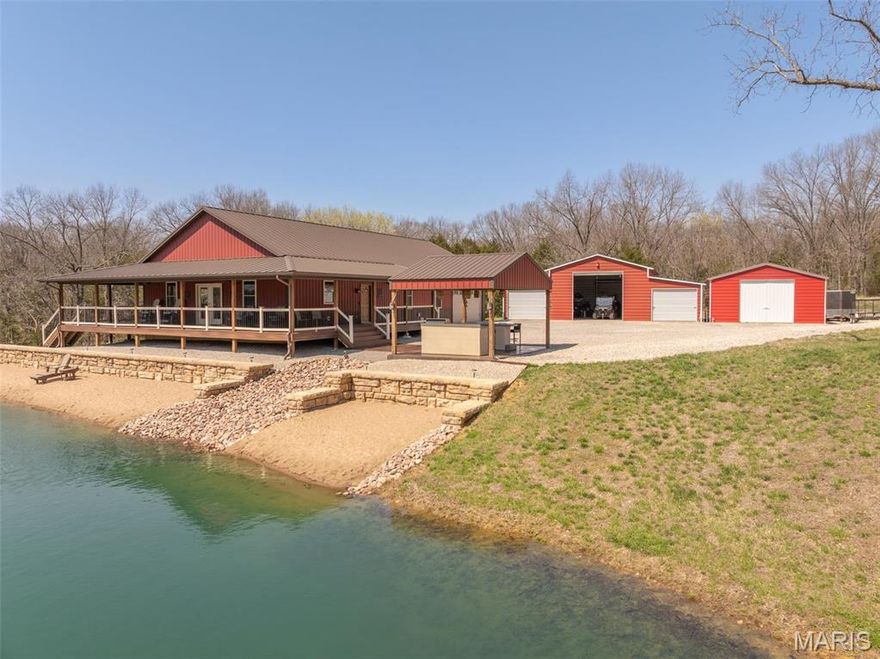Welcome to Hunters Paradise. 85+/- wooded acres with custom built 4 year new home. Enjoy the views from the Full wrap around composite porch overlooking the 3/4 ac lake, 4 ac lake and wooded property. 2 bed, 2 bath, w/MFL, Trophy room and o/s garage. Enjoy the vaulted great room and open kitchen, custom solid wood cabinets and granite counter tops.  The lower level partial walk out basement offers a full concrete safe room and processing area with commercial sink. The roof is top of the line "standing seam" metal. Want to cook out - the outdoor kitchen & bar is perfect for entertaining. After a long day, walk out of the owners suite, to the 8 person hot tub. There is plenty of room to store your equipment in the outbuildings and lean to. Check out the stone retaining wall and beach area that overlooks the stocked lakes. Prime deer and turkey hunting, maintenance of food plots and prescribed burning. Trails take you around the majority of the land. It's perfect peaceful country living.
