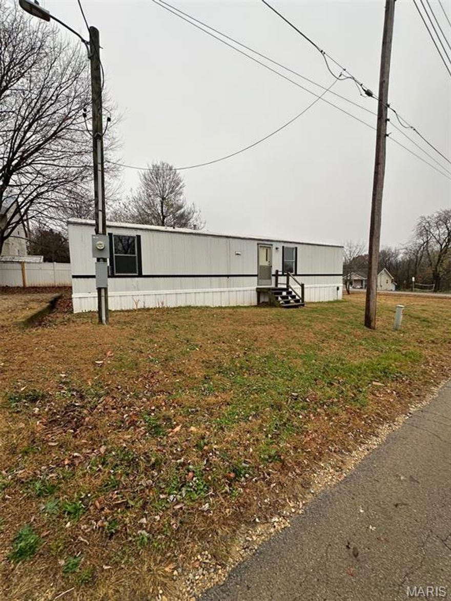 Cozy 2-bed, 1-bath single-wide on a convenient city lot—perfect for simple living or an investment opportunity. Easy access to town amenities, move-in ready and full of potential!