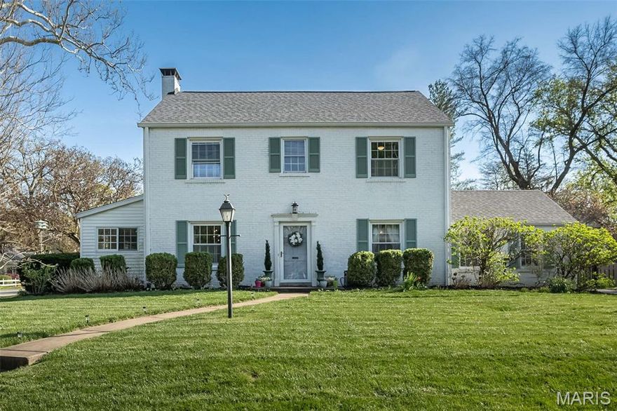 Classic charm meets modern living in the heart of highly sought-after downtown Kirkwood! A welcoming foyer introduces a spacious living room featuring a cozy wood-burning fireplace and custom built-ins with window seat along with a formal dining room perfect for gatherings. The updated kitchen is a true showstopper, boasting crisp white cabinetry, stainless steel appliances, a coffee bar/pantry niche, and an oversized breakfast bar with seating—all opening seamlessly to a stunning vaulted family room with a gas fireplace and custom built-ins and dry bar, creating the ideal open-concept layout buyers crave. The main level also offers a convenient half bath and a sun-drenched four-season room—perfectly appointed as a home office, library or flex space to fit your lifestyle. Upstairs, retreat to the spacious primary suite featuring a walk-in closet and private ensuite bath with double vanities. Two additional generously sized bedrooms and an updated full bath complete the upper level. The finished lower level provides valuable additional living space with a large family/rec room, another full bath and ample storage. Outside, enjoy your own private backyard oasis located on .289 acre corner lot—perfect for entertaining a crowd—with an oversized patio, newer pergola, fire pit area, lush green space, and privacy fencing. A two-car attached rear-entry garage and oversized parking pad add everyday convenience. This move-in ready home offers the perfect blend of character, updates, and location—just steps from everything downtown Kirkwood has to offer.