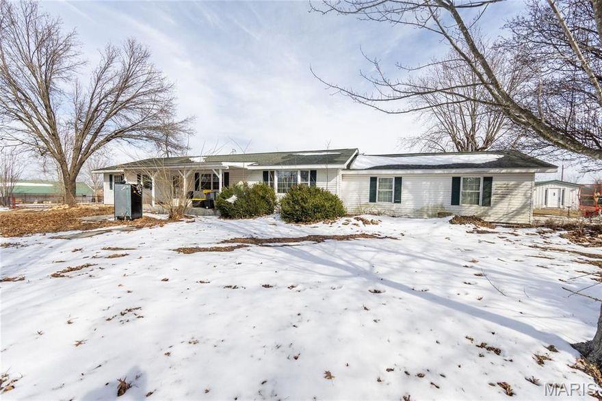 Horse/hobby farm on 20 +acres just off O highway and close to Rolla city limits. Property features a riding arena, fully fenced pasture, and ample space for livestock or recreational use. The home has strong exterior appeal and solid bones, but the interior requires a full remodel- an excellent opportunity to customize this 3 bed 2 bath home to your vision. Ideal for horse enthusiasts or buyers seeking acreage with convenience to town.