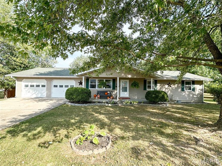 Discover the perfect blend of comfort and convenience in this well maintained 3-bedroom, 2-bath ranch home! Nestled on a spacious corner lot measuring 121' x 195', this property offers both privacy and ample outdoor space, thanks to its sturdy privacy fence.  Enjoy the updates of a top-of-the-line Bosch HVAC system, dishwasher, 60-gallon hot water heater, some luxurious vinyl plank flooring and relax or entertain on the expansive 20' x 20' deck.  Large living room with plenty of natural light from the triple windows. Kitchen with wood cabinets and some undercabinet lighting, dishwasher, electric range and refrigerator. Dining area with atrium door out to the deck and view of back yard. Separate laundry room. Primary bedroom with walk-in closet and a full bath. A full bathroom separates the 2 additional bedrooms, one with a walk-in closet.  5 closets. Attached 2-car garage provides easy access and storage space. 10' x 12' outbuilding. Prime location as this property can be zoned commercial as well. Close to shopping and dining. Schedule A Showing Today!