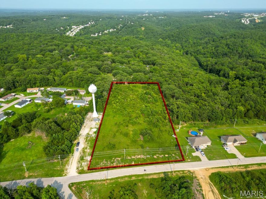 Great lot for multi family or residential development.  Potential for 6 to 8 building lots with level and ground and right next to road with utilities Additional Rooms: Other