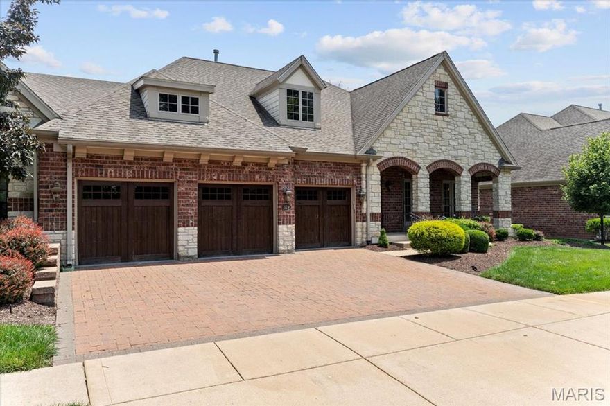 Resort-style living in the prestigious Meadowbrook Country Club. This exquisite Simon-built villa sits on a premier lot with breathtaking views of the lake and 6th fairway of the golf course. The striking stone & brick exterior features a welcoming front porch with arched stone openings and room to relax in a rocking chair. Unwind and watch the golfers from the back screened porch. Inside, you'll find high-end finishes throughout, including hardwood floors, custom millwork, crown molding, and fabulous views. The spacious main level showcases a chef’s kitchen with granite countertops, stainless steel appliances, a gas cooktop, built-in microwave oven combo, center island, and a full prep sink. The luxurious primary suite offers a spa like bathroom with a soaking tub, separate shower, dual vanities, and a generous walk-in closet. A large family room with theater screen & projector and walk up bar with custom cabinets, fridge and wine cooler provide a perfect area for entertaining. Two bedrooms and a full bath are located in the finished lower level with ample natural light and two storage areas. Desirable three-car garage, some newer carpet and the ease of villa living makes this a true treasure. Meadowbrook members can enjoy golf, tennis, swimming, pickleball, dining, and fitness center. Don’t miss this rare opportunity to own a prime golf course lot, in a luxury villa community!