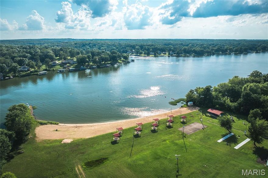 This lot is located in a gated community with a 326 acre (+/-) lake. Build your dream home, a weekend cabin or just use for access to enjoy the lake and community amenities. Spend your summer days boating, fishing, skiing, tubing and swimming. There is a sandy beach with pavilions, a playground and basketball court. The pickleball/tennis courts have been recently updated. There are several locations around the lake to launch your boat and day-use docks are available to members. Community events include poker runs, bingo nights, trivia nights, beach party with DJ and lots of other ways to have a great time at the lake year round.