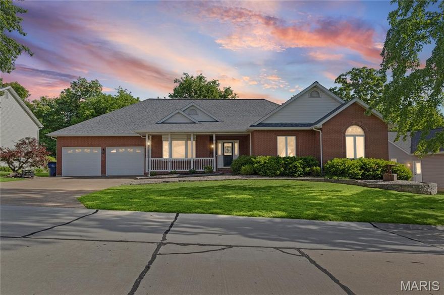 Timeless durability, low maintenance, and timeless elegance define this exceptional all-brick residence at 65 Ashford Place in Festus. Originally built as a builder’s personal home, it showcases an impressive array of quality finishes and thoughtful design throughout.

Offering almost 4,500 square feet of living space, this full masonry home features five spacious bedrooms, three full bathrooms, and one half bath. A formal dining room, currently utilized as a private office, adds versatility to the layout. The expansive living room provides a welcoming atmosphere, highlighted by a gas fireplace and ample space for gathering.

The gourmet kitchen is a true centerpiece, appointed with stainless steel appliances, granite countertops, custom cabinetry, and top of the line built-in oven and microwave. Just off the kitchen, the inviting hearth room creates the perfect setting for casual conversation and connection. A charming breakfast nook with glass doors open into a bright sunroom, blending indoor comfort with outdoor views.

One of the home’s standout features is its exceptional outdoor living space, including a covered 13’ x 24’ composite deck overlooking a fully fenced yard, ideal for both relaxation and entertaining.

The luxurious primary suite offers a private retreat, complete with a spa-inspired bathroom and generous walk-in closets. The finished lower level is equally impressive, featuring a large recreation area with a custom bar, a comfortable family room, an exercise space, and a bonus room suitable for additional sleeping quarters. A private bedroom and full bath in the lower level provide an excellent option for guests or multi-generational living.

Blending quality craftsmanship with functional elegance, this home also includes select accessibility features. Why wait to build when you can experience this level of comfort, style, and sophistication today?