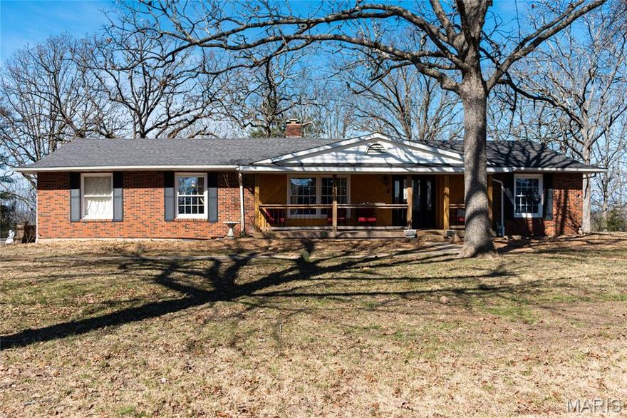 Charming 2-bedroom, 2-bath home situated on nearly an acre, offering the perfect blend of space and convenience just minutes from shopping and dining. Enjoy relaxing mornings or evenings on the beautiful front porch, overlooking the peaceful setting. Inside, you’ll find a formal living room with a designated dining area, along with a cozy family room featuring a wood-burning fireplace—perfect for gathering and entertaining.

The spacious kitchen is equipped with a gas stove and ample cabinet and counter space, making it ideal for everyday living or hosting guests. A huge unfinished basement provides endless possibilities for expansion, storage, or creating your dream space. The oversized garage offers plenty of room for vehicles, tools, or hobbies.

Outside, the property features a lovely, tree-lined lot with a patio area—perfect for enjoying the outdoors. This home offers comfort, functionality, and room to grow in a great location!