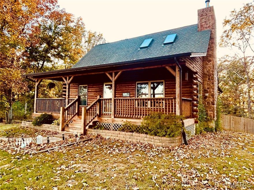 Escape to your dream getaway! This charming 1.5-story log cabin, nestled on just over 3 acres of serene countryside, offers the perfect blend of rustic charm and modern comfort. Step into the spacious great room, where soaring ceilings and warm wood accents create an inviting atmosphere, ideal for gatherings or quiet evenings by the fire. Featuring 2 cozy bedrooms and 2 full baths, this home ensures comfort for family and guests. The kitchen has custom cabinetry with granite countertops & center island. The full basement provides additional sleeping areas, roughed in plumbing for a 3rd bathroom and spacious laundry area. Outside, a full wrap-around deck offers stunning views of the surrounding countryside, perfect for morning coffee or evening stargazing. With ample space, privacy, and endless potential, this log cabin is your slice of paradise.